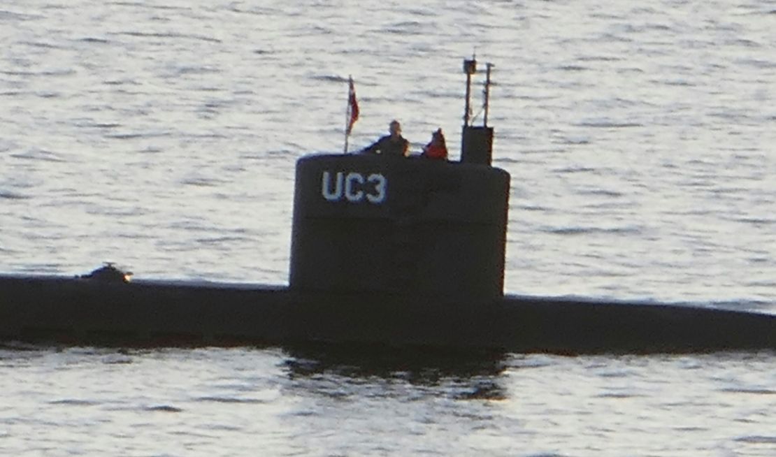 This image is thought to be the final photo of Swedish journalist Kim Wall. She's seen standing with Peter Madsen in the tower of his private submarine on August 10, 2017 in Copenhagen Harbor. 