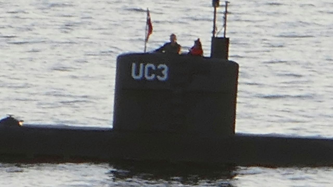 This image is thought to be the final photo of Swedish journalist Kim Wall. She's seen standing with Peter Madsen in the tower of his private submarine on August 10, 2017 in Copenhagen Harbor. 