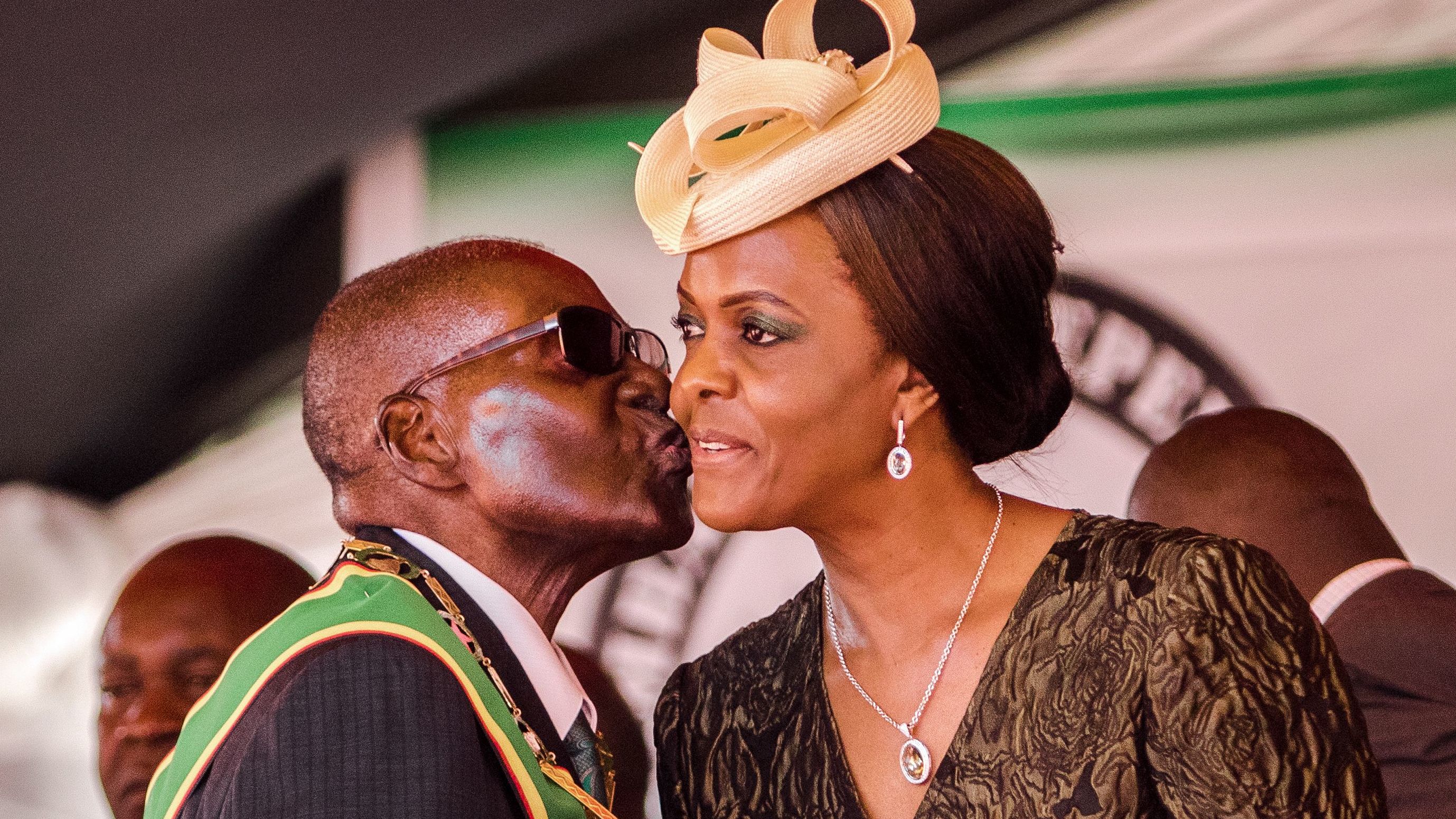 President Robert Mugabe kisses first lady Grace Mugabe during Zimbabwe's 37th Independence Day celebrations in April.