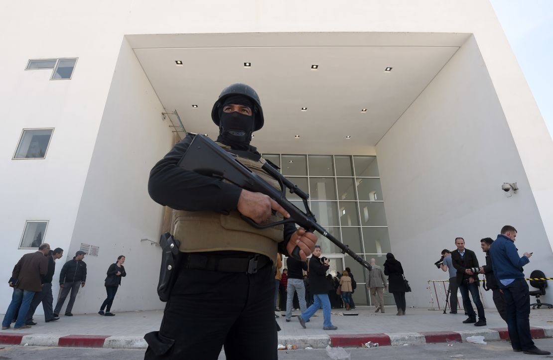 A member of the Tunisian security forces stands guard at the National Bardo Museum in Tunis after an attack on foreign tourists. Security has been bolstered at tourist sites across the country. 