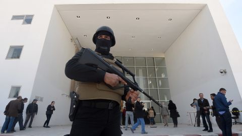 A member of the Tunisian security forces stands guard at the National Bardo Museum in Tunis after an attack on foreign tourists. Security has been bolstered at tourist sites across the country. 