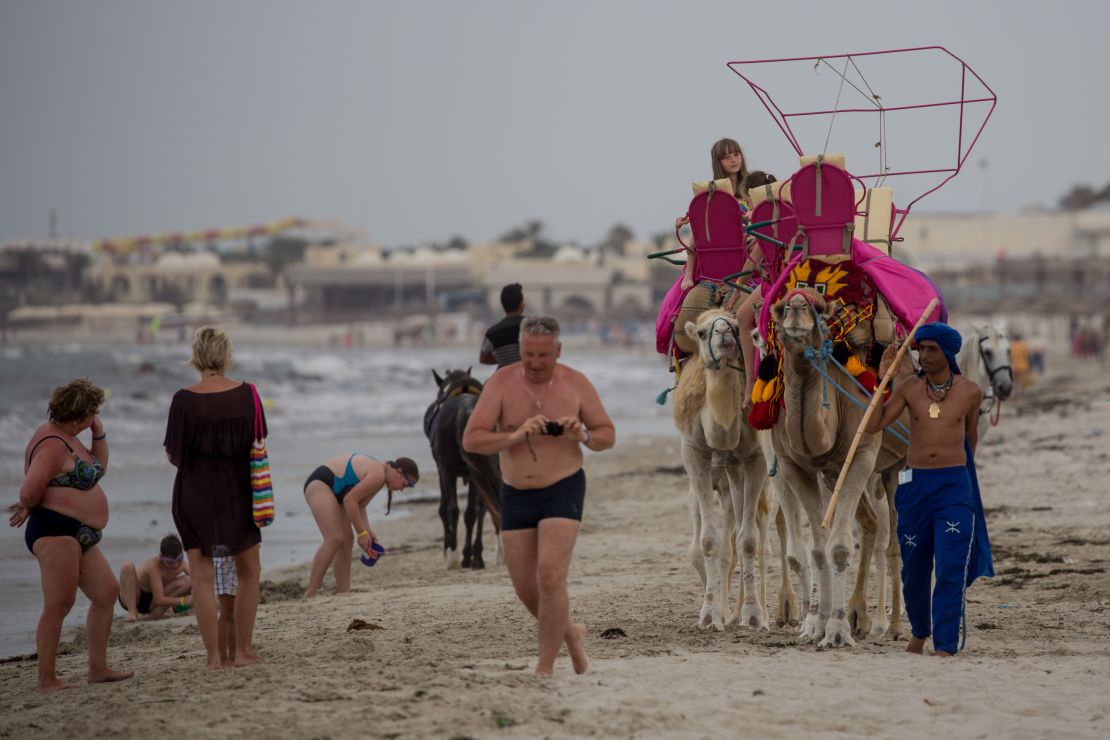 Tourists on a beach in Sousse a year after the attacks. Recent statistics show a recovery of visitor numbers. 