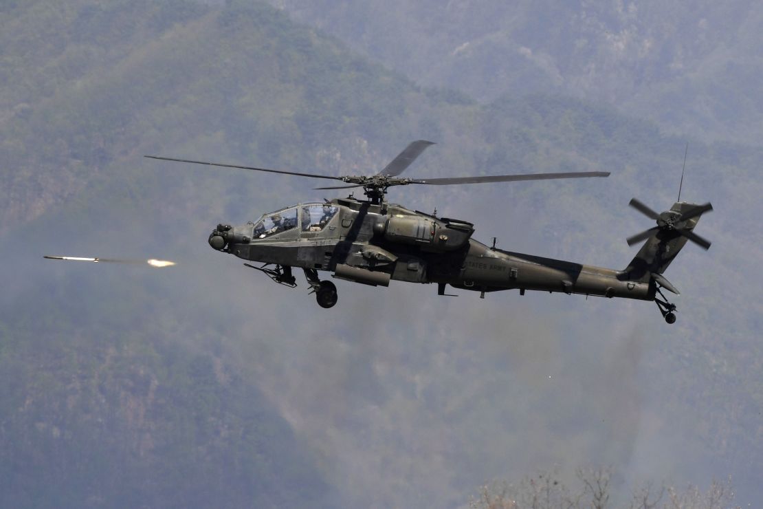 A US AH-64 Apache helicopter fires rockets during a joint live firing drill between South Korea and the US in 2017.