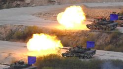 South Korean K1A2 tanks fire live rounds during a joint live firing drill between South Korea and the US at the Seungjin Fire Training Field in Pocheon, 65 kms northeast of Seoul, on April 26, 2017. / AFP PHOTO / JUNG Yeon-Je        (Photo credit should read JUNG YEON-JE/AFP/Getty Images)