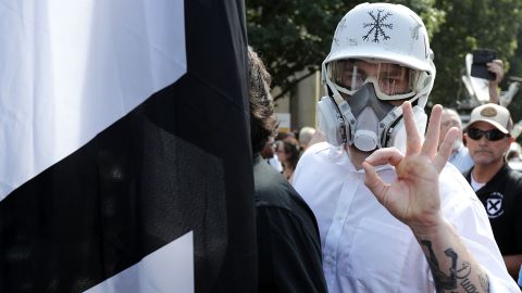 A member of the alt-right displays an 'OK' sign at Charlottesville - one of the seemingly innocuous gestures co-opted by the white power movement.