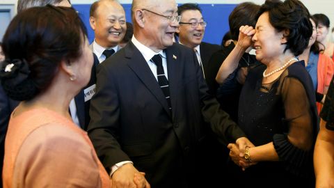Lim is greeted by members of his congregation at the Light Korean Presbyterian Church.