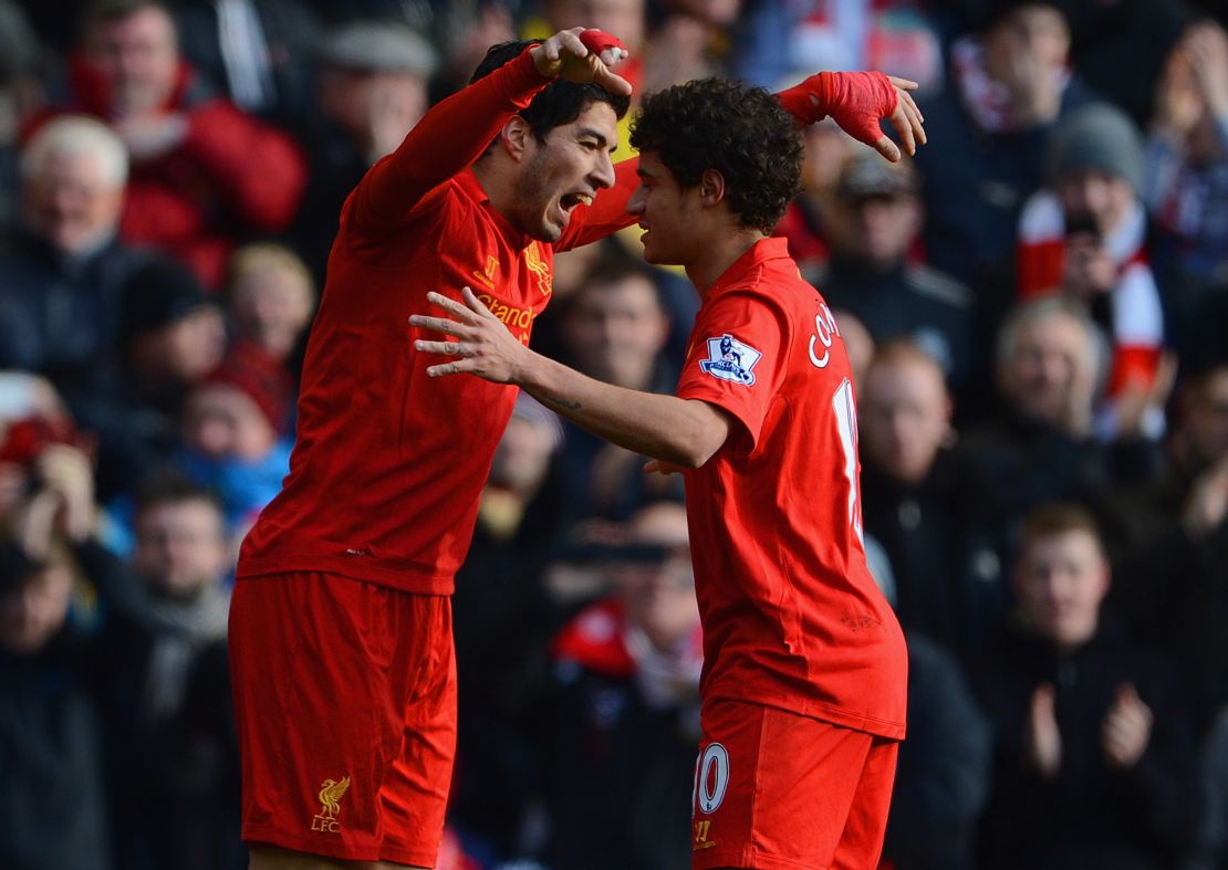 Luis Suarez and Philippe Coutinho are pictured playing together for Liverpool in 2013.