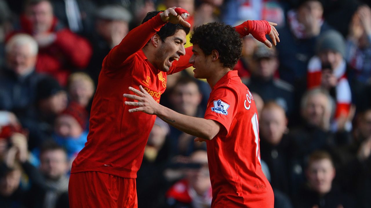 Luis Suarez and Philippe Coutinho are pictured playing together for Liverpool in 2013.