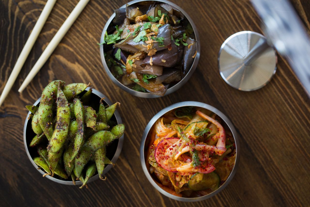 Sides of spiced edamame, eggplant and kimchi complement <strong>Urban Belly's</strong> noodle and rice bowls. The restaurant is just one of a diverse array of eateries in Chicago's West Loop. Click through the gallery for more.