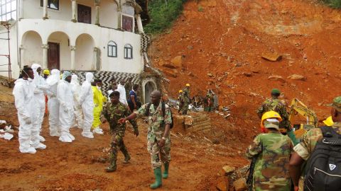 A search-and-rescue team and soldiers operate at the disaster site this week in Freetown.
