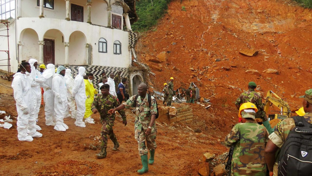 A search-and-rescue team and soldiers operate at the disaster site this week in Freetown.