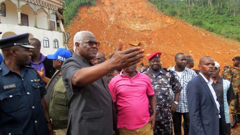 Sierra Leone's President Ernest Bai Koroma visits the site of a mudslide near Freetown on Tuesday.