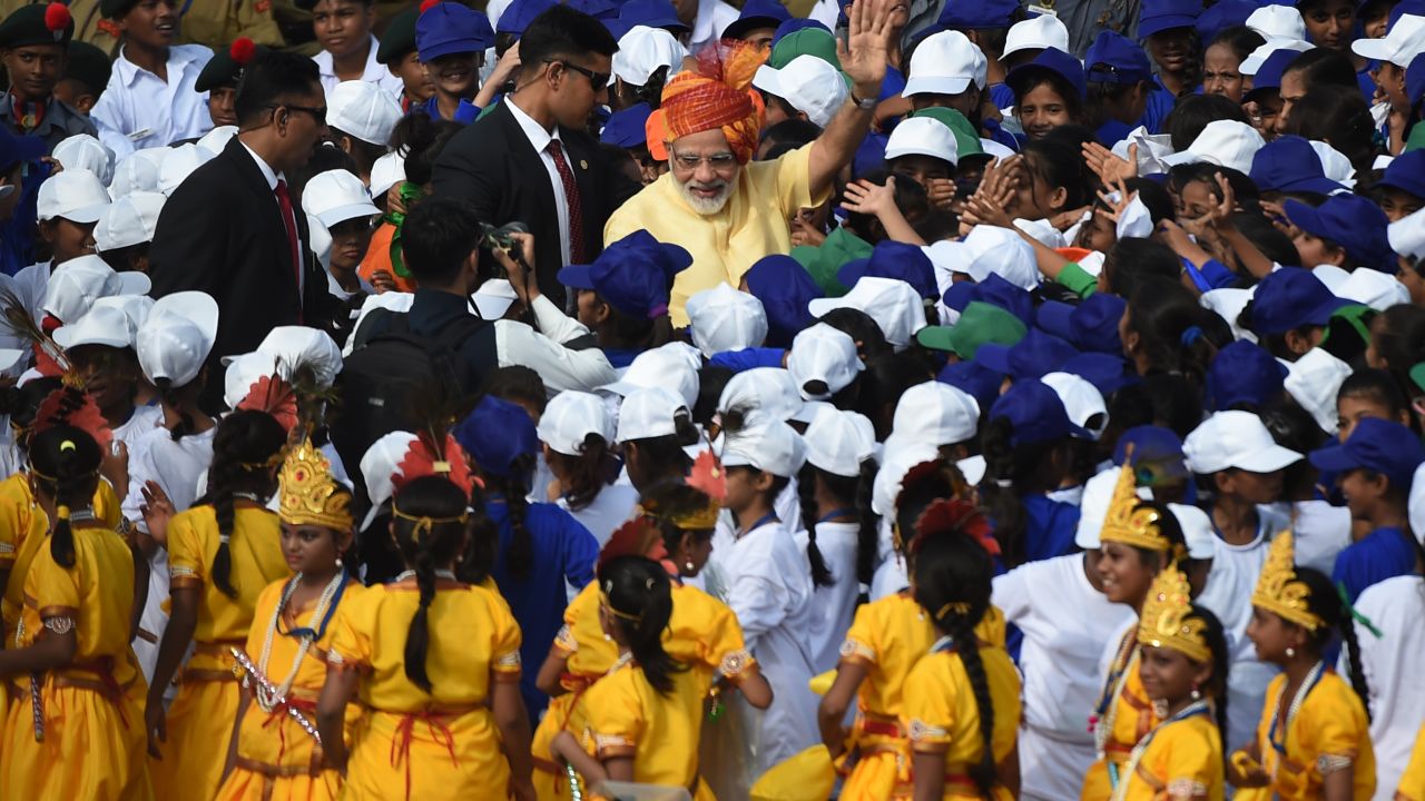 Modi greets school children during celebrations to mark the 70th anniversary of the end of British colonial rule.