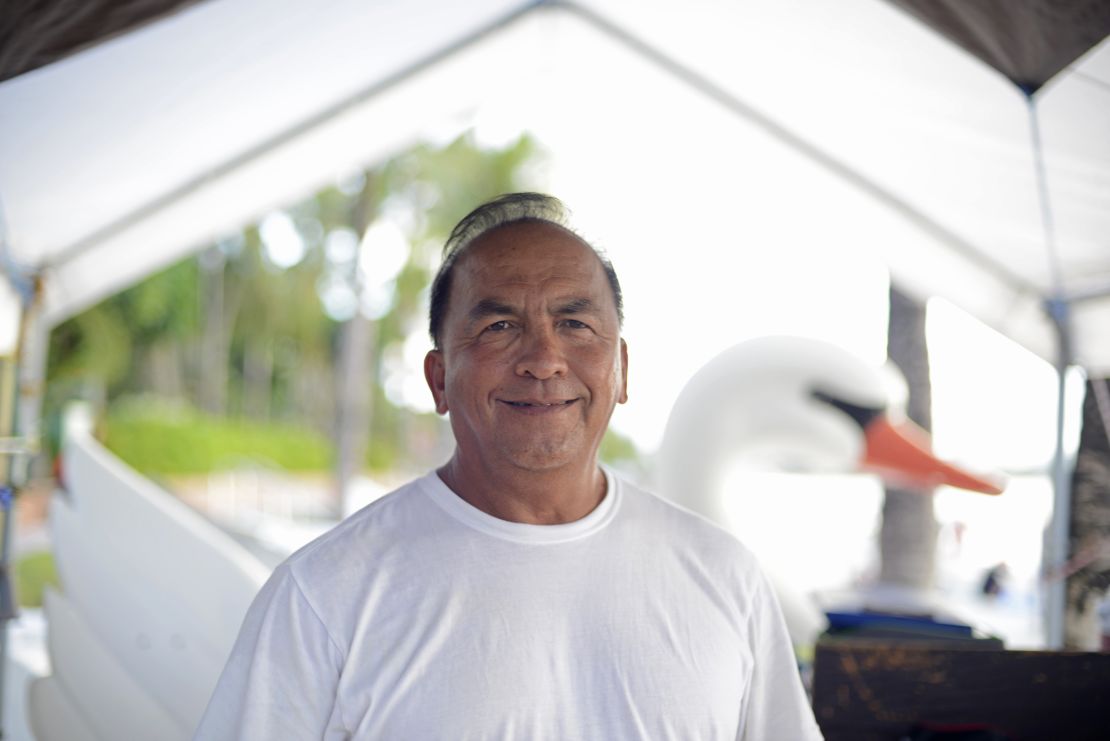 Edwin Cruz, 59, works on Guam's Tumon Beach.