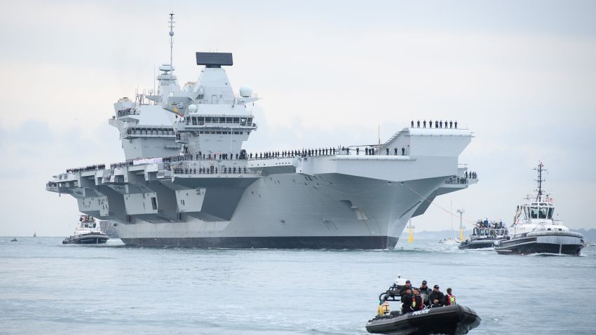 PORTSMOUTH, ENGLAND - AUGUST 16:  The HMS Queen Elizabeth supercarrier heads into port on August 16, 2017 in Portsmouth, England.  The HMS Queen Elizabeth is the lead ship in the new Queen Elizabeth class of supercarriers. Weighing in at 65,000 tonnes she is the largest war ship deployed by the British Royal Navy.   (Photo by Leon Neal/Getty Images)