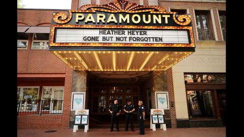 Police officers stand watch Wednesday at the Paramount Theater in Charlottesville.