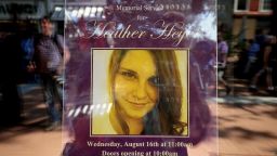 A poster announcing the memorial service for Heather Heyer, who was killed when a car slammed into a crowd of people protesting against a white supremacist rally, stands in the window of the Paramount Theater August 16, 2017 in Charlottesville, Virginia. Charlottesville will hold a memorial service for Heyer Wednesday, four days after she was killed when a participant in a white nationalist, neo-Nazi rally allegedly drove his car into the crowd of people demonstrating against the 'alt-right' gathering. 