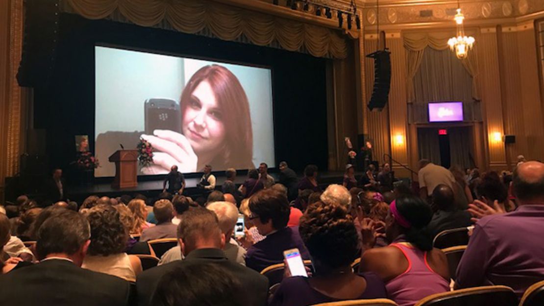 Photos of Heather Heyer are shown as people take their seats at a memorial service for Heyer at the Paramount Theater, in Charlottesville, Virginia, on August  16, 2017.