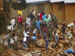 Volunteers search for bodies from the scene of heavy flooding and mudslides in Regent, just outside of Sierra Leone's capital Freetown. 