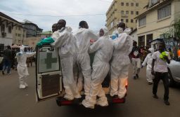 Members of a burial team head out from the Freetown morgue.
