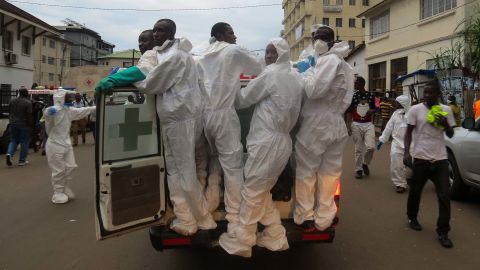 Members of a burial team head out from the Freetown morgue.