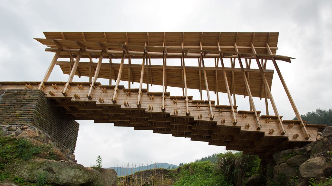 Made from interlocking pieces of timber, Donn Holohan's Wind and Rain Bridge was designed to reconnect remote Chinese villages that had been affected by heavy flooding in 2014.