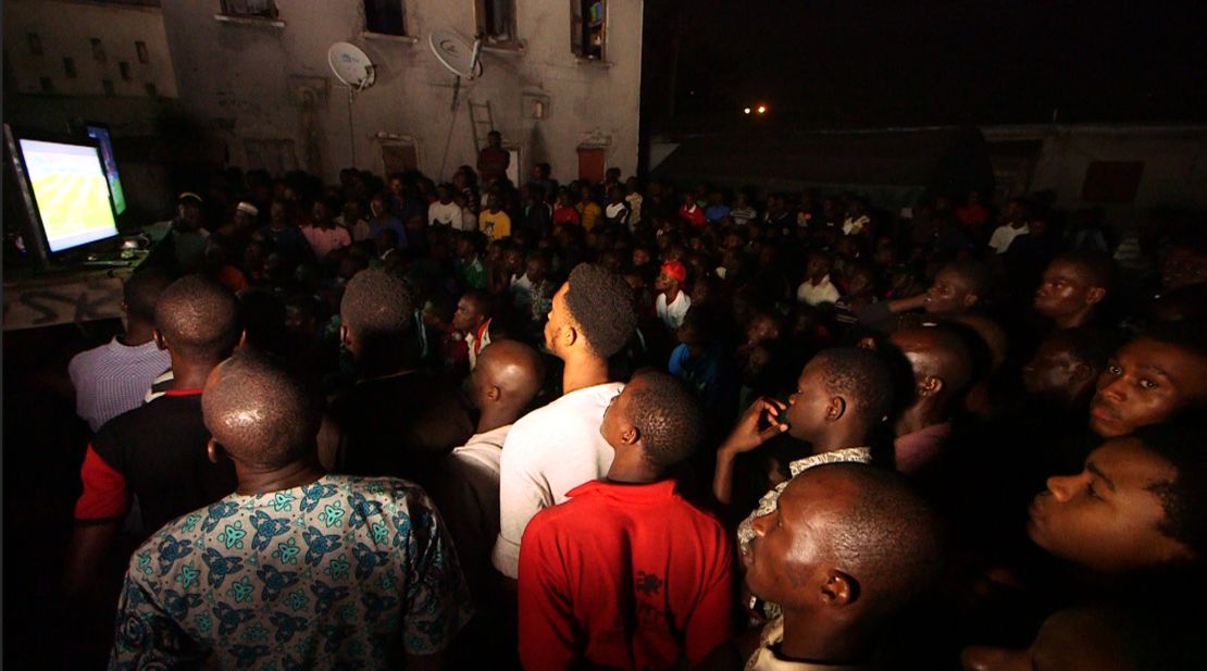 Football fans in Lagos watching a Premier League match 