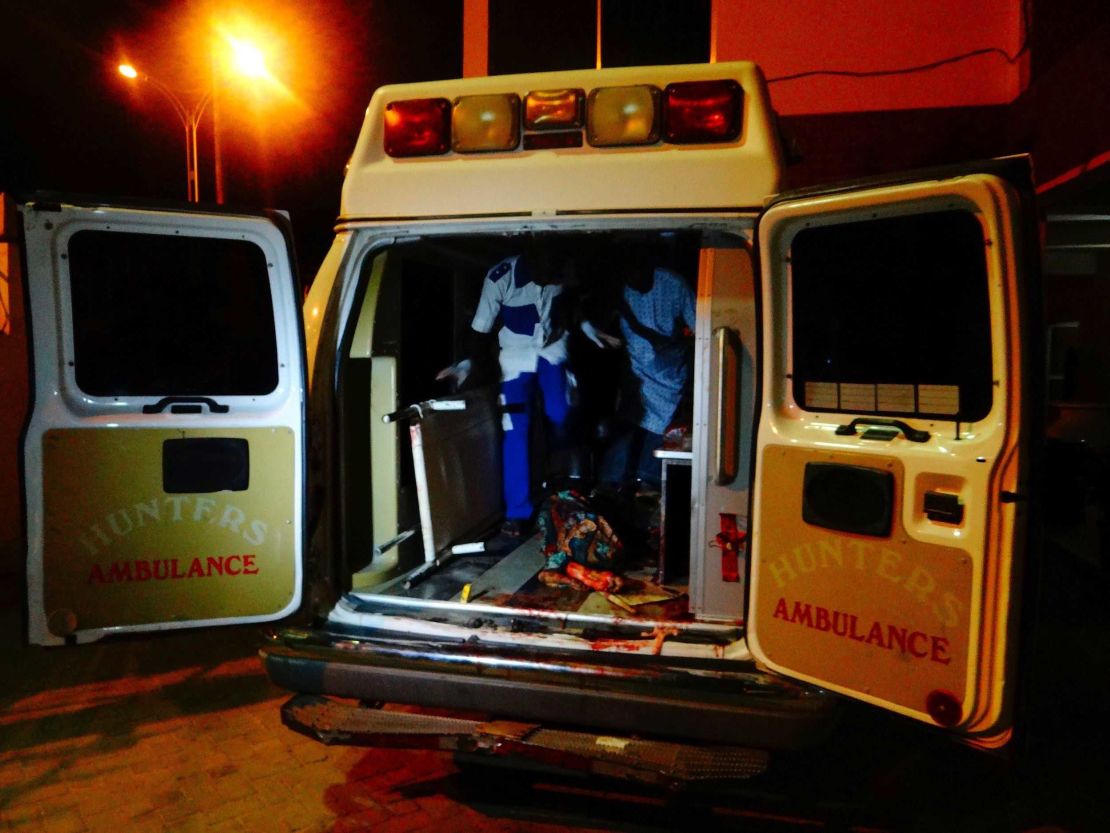 An injured victim of a female suicide bomber arrives in an ambulance for medical attention at a Maiduguri hospital.