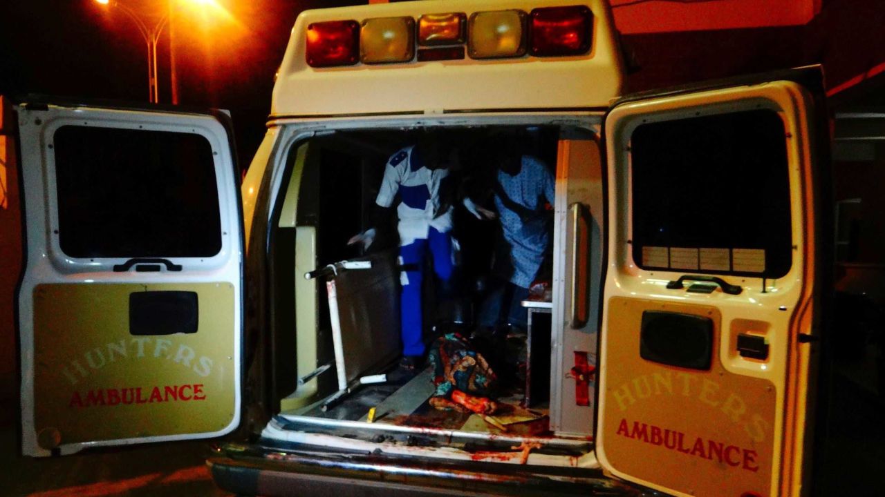 An injured victim of a female suicide bomber arrives in an ambulance for medical attention at a Maiduguri hospital.