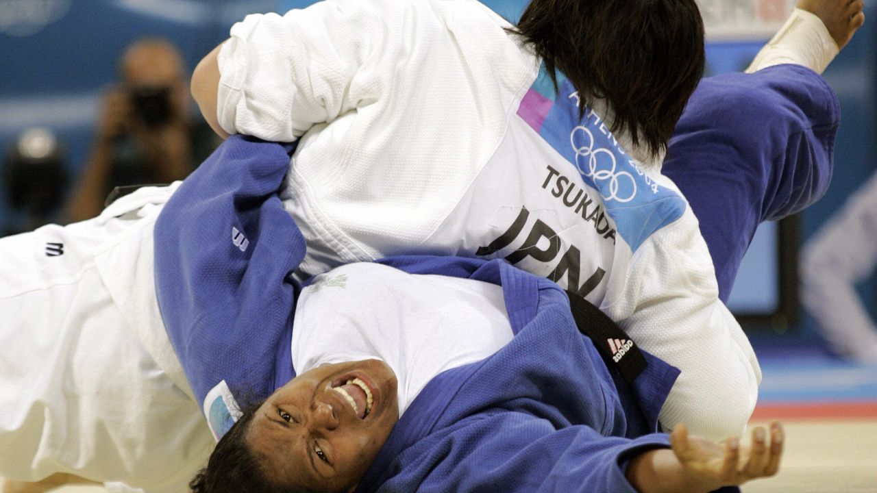 Maki Tsukada of Japan pins Dayma Beltran of Cuba for ippon during their gold medal match at the 2004 Athens Olympics.