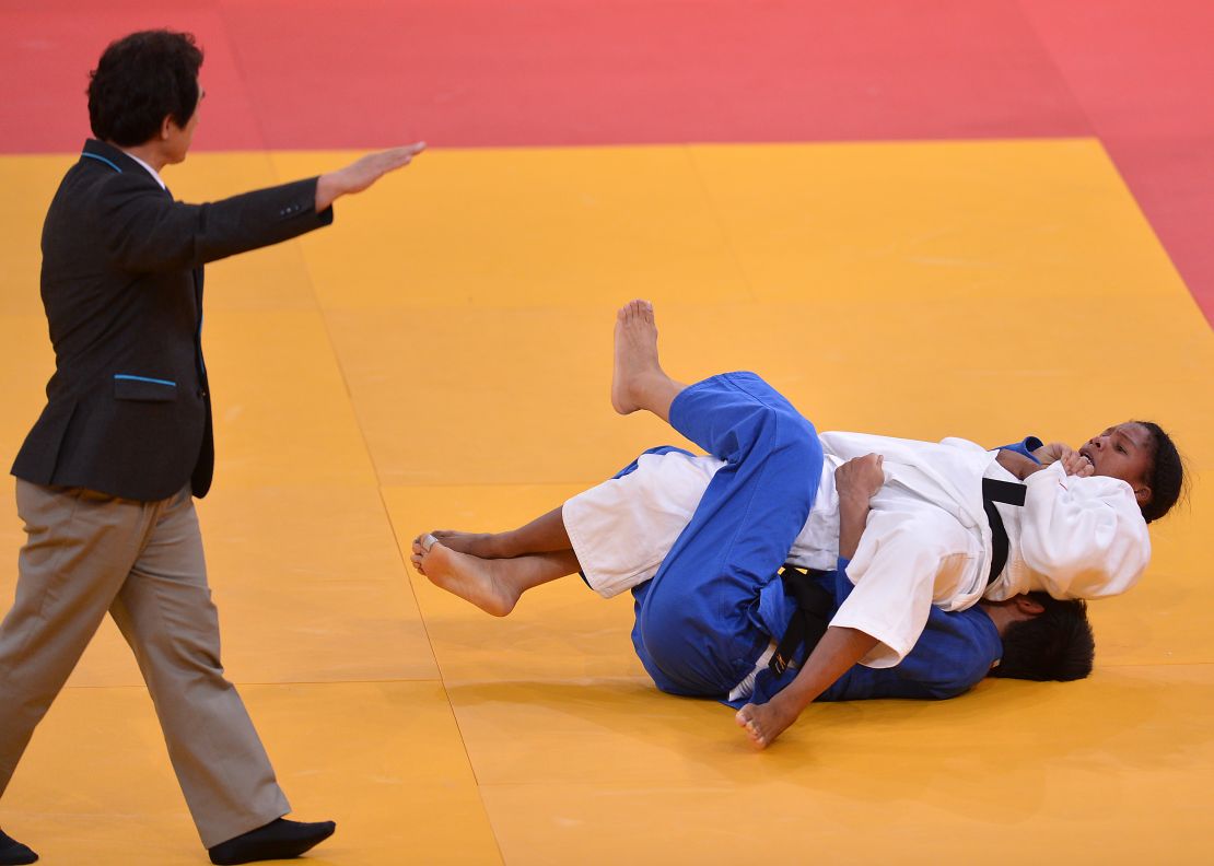 Colombia's Yuri Alvear (white) scores a waza-ari against China's Fei Chen at the London 2012 Olympic Games.