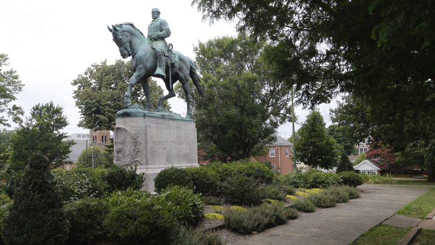 In this photo taken Aug. 14, 2017, the statue of Confederate General Robert E. Lee still stands in Lee park in Charlottesville, Va. Weeks before a statue of Robert E. Lee in Charlottesville, Virginia, became a flashpoint in the nation's struggle over race and history, it already was a focus of emotional debate in the state's Republican primary election.  (AP Photo/Steve Helber)