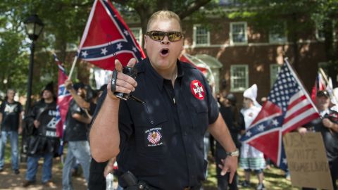 Was it "ethno-nationalism,"  "racial anxiety" or just plain racism that motivated demonstrators like this man at the Charlottesville protests in 2017? The words we use matter, some say.
