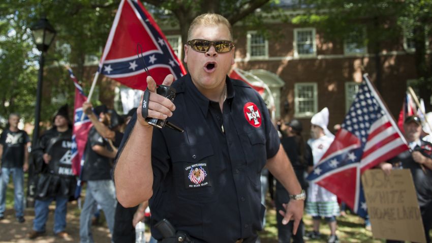 TOPSHOT - A member of the Ku Klux Klan shouts at counter protesters during a rally, calling for the protection of Southern Confederate monuments, in Charlottesville, Virginia on July 8, 2017.
The afternoon rally in this quiet university town has been authorized by officials in Virginia and stirred heated debate in America, where critics say the far right has been energized by Donald Trump's election to the presidency.
 / AFP PHOTO / ANDREW CABALLERO-REYNOLDS        (Photo credit should read ANDREW CABALLERO-REYNOLDS/AFP/Getty Images)