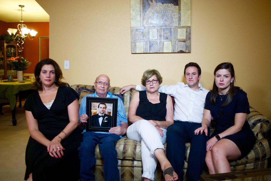 The Jabara family holds a photo of Khalid. From left are Victoria, Mounha, Haifa, Rami and Jenna.