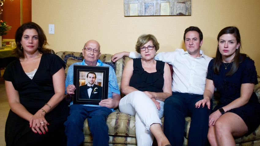 The Jabara family sits with a photo of Khalid. From left: Victoria, Mounha, Haifa, Rami, and his wife, Jenna.