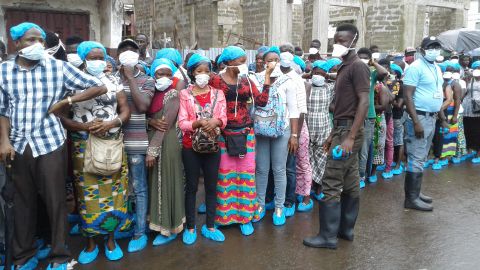 Relatives of victims of floods gather outside a morgue in Freetown, Sierra Leone, on Wednesday.