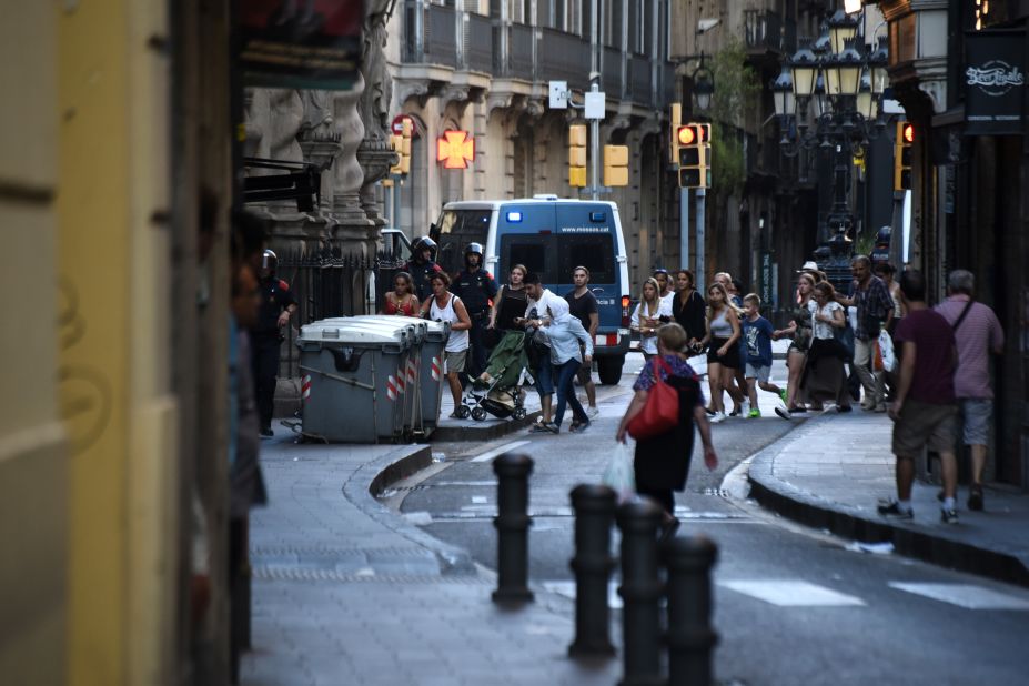 People flee the scene after the attack at Las Ramblas.