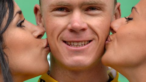 Chris Froome being kissed by two hostesses on the podium of the Tour de Romandie cycling race in Belgium in 2013. Branded sexist by some, could these podium girls soon become a thing of the past?