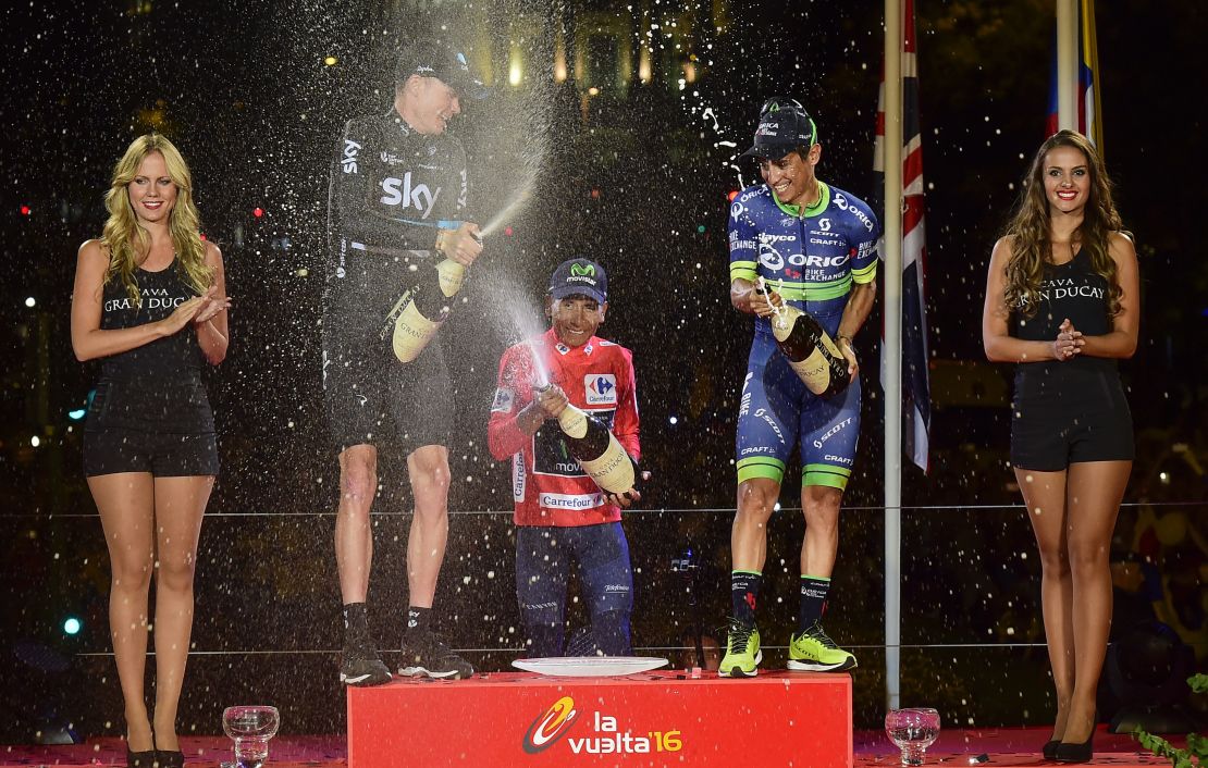 The Vuelta podium girls at work during last year's trophy ceremony with overall winner Nairo Quintana (middle), Chris Froome (left) and Esteban Chaves.