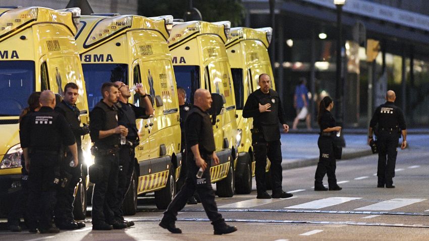 BARCELONA, SPAIN - AUGUST 17:  Paramedics are seen near to the scene of a terrorist attack in the Las Ramblas area on August 17, 2017 in Barcelona, Spain. Officials say 13 people are confirmed dead and at least 50 injured after a van plowed into people in the Las Ramblas area of the city this afternoon.  (Photo by David Ramos/Getty Images)