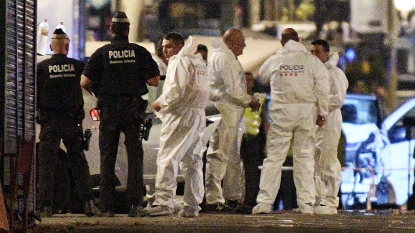 BARCELONA, SPAIN - AUGUST 17:  A damaged van, believed to be the one used in the attack, is surrounded by forensics officers in the Las Ramblas area on August 17, 2017 in Barcelona, Spain. Officials say 13 people are confirmed dead and at least 50 injured after a van plowed into people in the Las Ramblas area of the city.  (Photo by David Ramos/Getty Images)