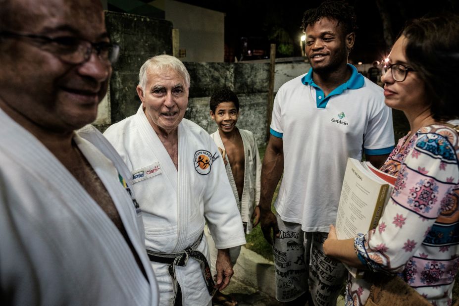 In order to achieve his dream he is being trained by Geraldo Bernardes (second from left) in Rio.