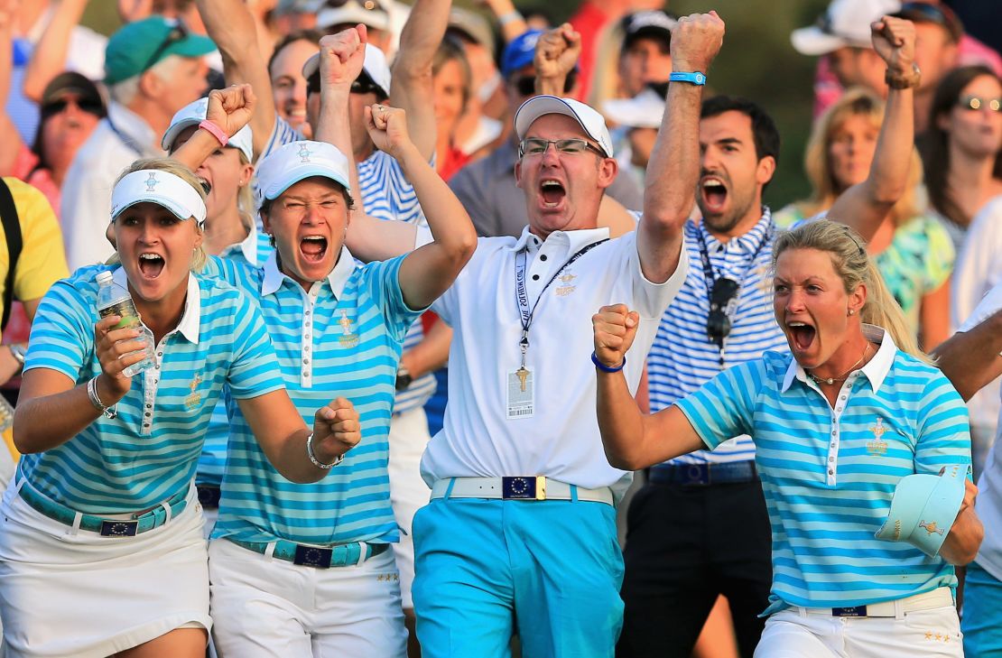 Catriona Matthew (second from left) celebrates Solheim Cup victory in 2013 with her husband and caddy Graeme Matthew.