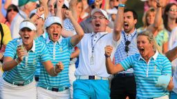 Catriona Matthew (second from left) celebrates Solheim Cup victory in 2013 with her husband and caddy Graeme Matthew.