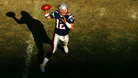 The player passes to teammate Heath Evans for a touchdown while playing the Miami Dolphins in October 2006.