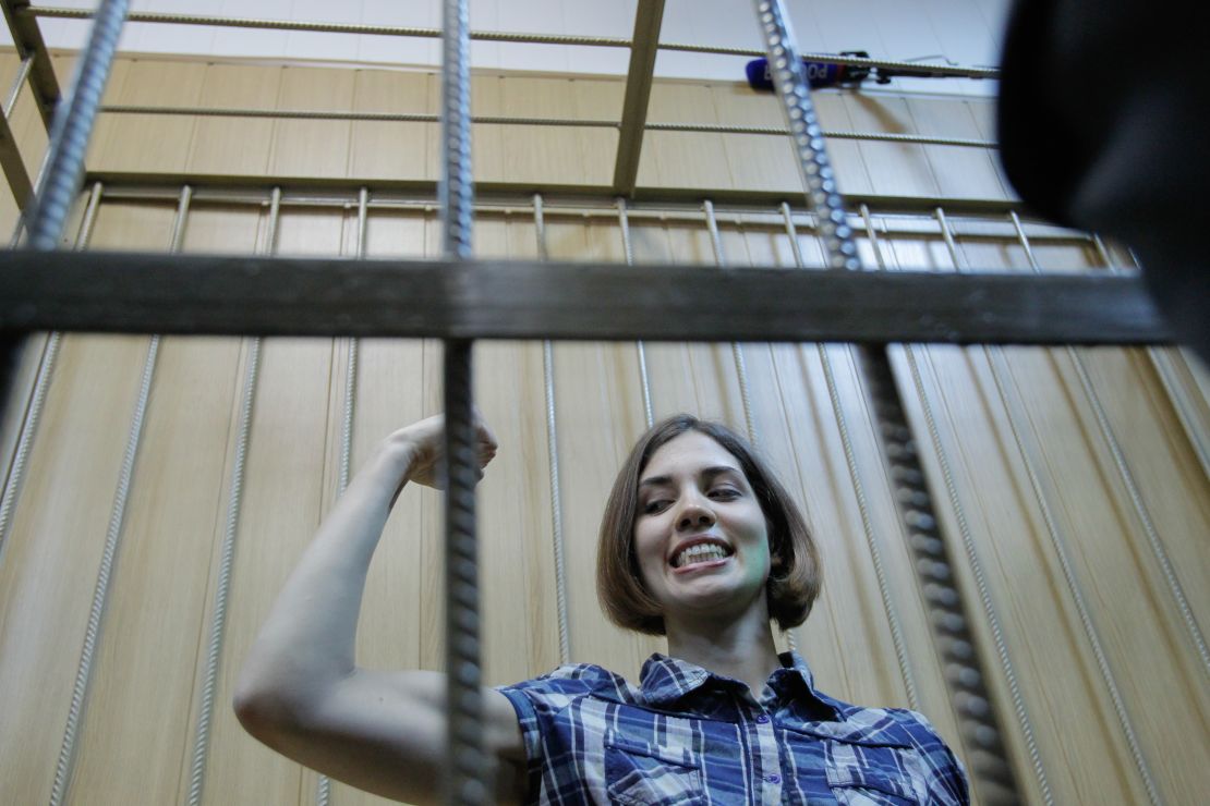 Pussy Riot's Nadya Tolokonnikova is seen behind the bars during a trial in Moscow.