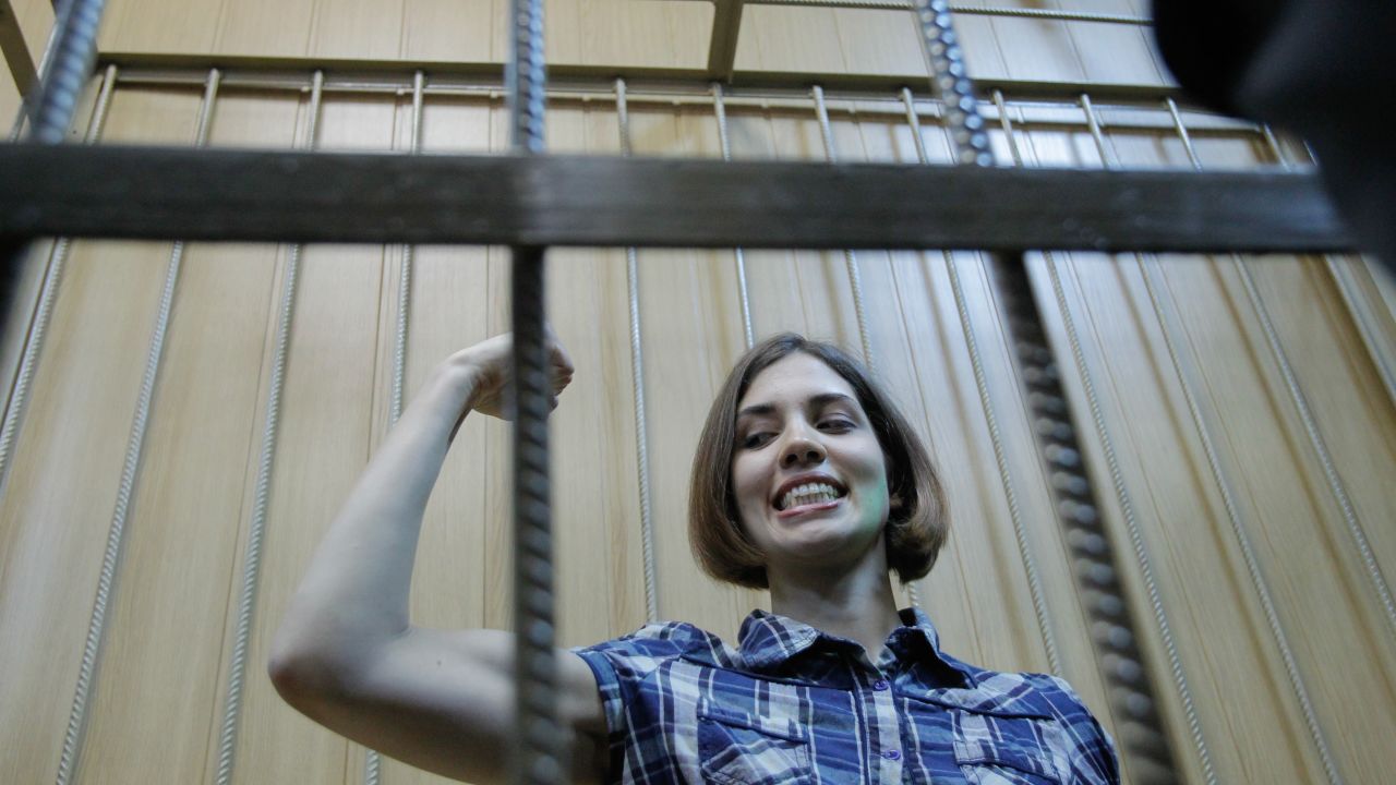Pussy Riot's Nadya Tolokonnikova is seen behind the bars during a trial in Moscow.