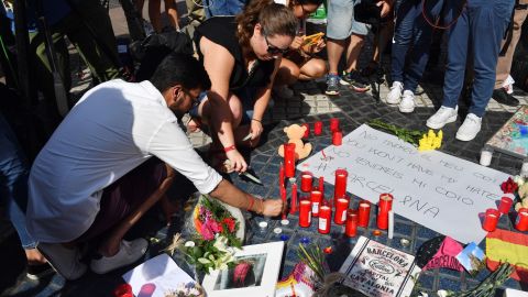 Mourners have begun leaving flowers, candles and heartfelt messages at the spot on Las Ramblas where the attacker's rampage came to an end.