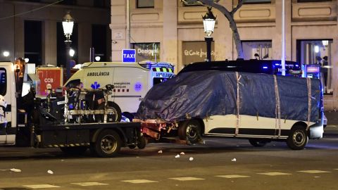 The van that plowed into the crowd in Barcelona is towed away from Las Ramblas on August 18.